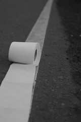 Fototapeta premium paper tualiet ubornaia unitaz covid People are stocking up toilet paper for home quarantine Woman holds many rolls of toilet paper