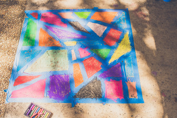 Kid's sidewalk chalk art abstract with tape