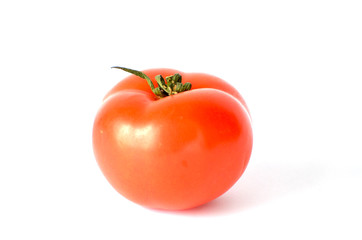 Close-up ripe  tomato on white background, studio photo