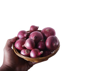 some onions in a basket on white background 