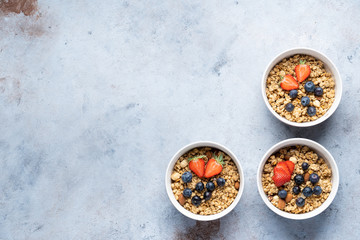 Tasty Strawberry Dessert, Homemade Granola with Strawberries, blueberries, raspberries and red currants. Seeds, Healthy Breakfast, Parfait in a Jar over Bright Background