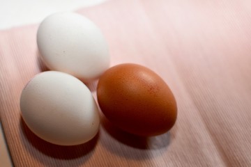 Trio of eggs on kitchen linen 