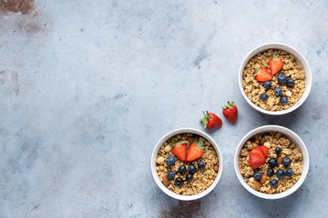 Tasty Strawberry Dessert, Homemade Granola with Strawberries, blueberries, raspberries and red currants. Seeds, Healthy Breakfast, Parfait in a Jar over Bright Background