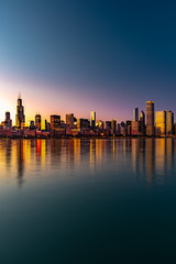 Fototapeta na wymiar Chicago downtown skyline sunset Lake Michigan with most Iconic building from Adler Planetarium, Illinois