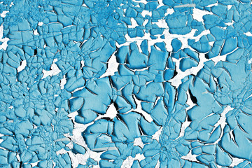 Old peeling paint texture. Grunge cracked wall background. Blue color weathered surface. Broken wood structure. Vintage pattern design.