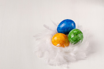 Easter eggs on white background. Colorful easter eggs in the nest