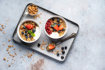 Tasty Strawberry Dessert, Homemade Granola with Strawberries, blueberries, raspberries and red currants. Seeds, Healthy Breakfast, Parfait in a Jar over Bright Background