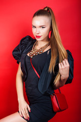 young pretty woman young lady posing on red background, lifestyle people concept