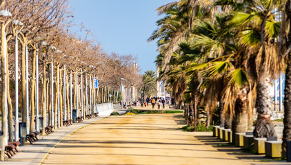 Beach walk Calella Beach  Barcelona Spain - 334027762