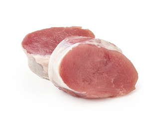 Fresh raw pork chop slices isolated on white background. Two pork medallions.