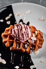 Viennese Waffles with ice cream and coffee. Beautiful picture of dessert with latte coffee. Dessert concept, sweet life. Food photo, copy space, gray background.