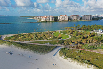 South Pointe Park in Miami Beach, Florida devoid of people during coronavirus pandemic beach and park closures with Fisher Island in background.