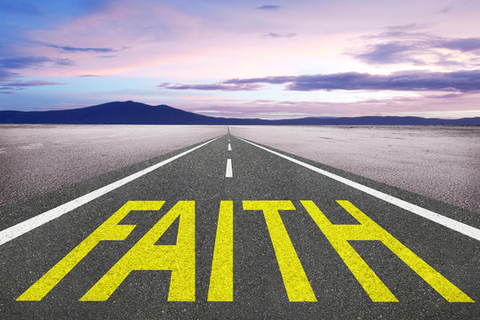 Faith word written on road of life for trust and spirituality concept.