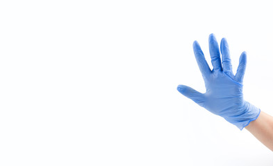Hand in blue medical glove, five fingers, palm open hand. Medicine, hygiene, virus protection and COVID-19 coronavirus pandemic concept. Copy space. Place for your text