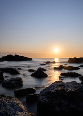 Fototapeta premium the sunset at the background in the atlantic ocean, Punta Ballena, Maldonado, Uruguay