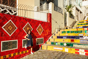 Child posing on the staircase selaron, colorful tourist spot made of tile in the famous...