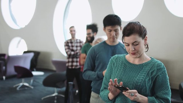 Group of Adults waiting in line