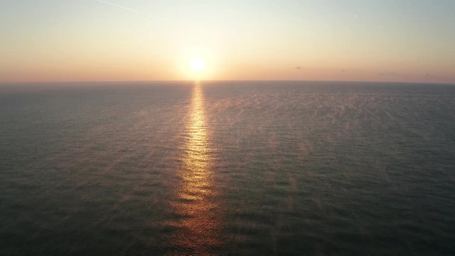 Aerial video over the morning calm sea and beautiful sunrise - Black Sea, Bulgaria