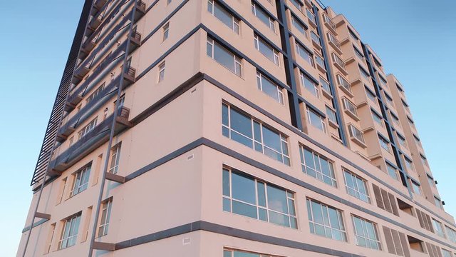 Aerial View Of An Apartment Building At Sunset. Aerial Landscape Of Modern Apartment Building