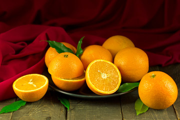 oranges lie on a plate, citrus fresh juicy orange fruits, vitamins and health, organic products, healthy food