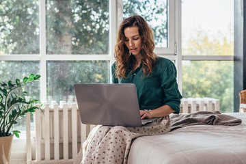 Woman using working on laptop and working from home