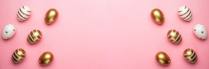 Easter basket with Colorful shine decorated eggs isolated on pink background. for you poster or flyer