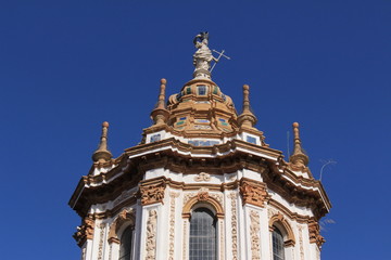 Fototapeta premium The bell tower of Church of Santa Catalina (Iglesia de Santa Catalina) which was built in 14th century in Seville, Andalusia, Spain.