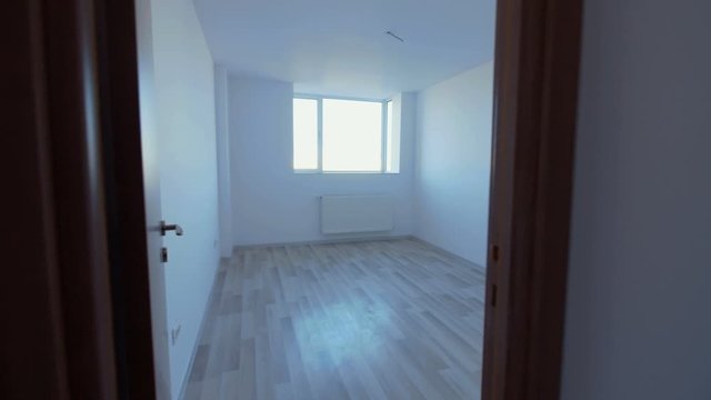Empty Light Room With Wooden Floor  In New Apartment