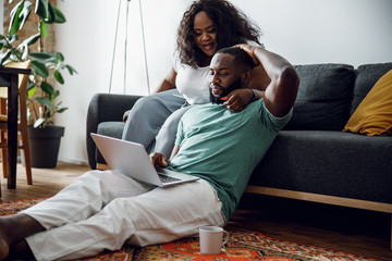 Calm man and woman sitting with laptop stock photo