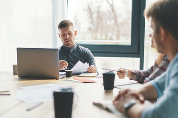Diverse team working on project during coffee break