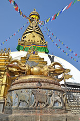 One of the stupas (prayer hall) with its traditional decoration: colorful flags with prayers. Kathmandu, Nepal
