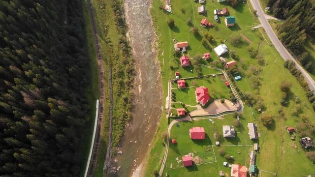Aerial drone perspective of Yaremche village along the Prut River.