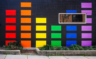 A colorful wall mural of colorful rectangles painted on an urban building.   © Mark Alan Howard