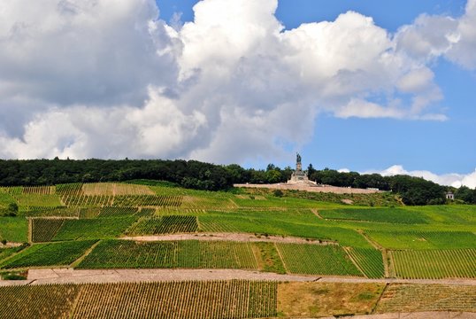 Niederwalddenkmal, Germania statue stands on the hill over looking a vineyard. Taken from Bingen Am Rhein towards R&uuml;desheim Am Rhein, Germany.