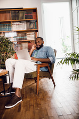 Calm man at home working in quiet stock photo