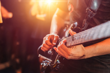 Guitarist play music song on stage.