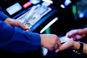 person winning money in slot machine