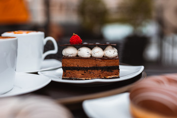 Chocolate cake with strawberry in dish. Dessert concept.
