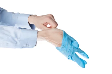Foto op Plexiglas office manager put on blue latex gloves, closeup. © Anastasiya