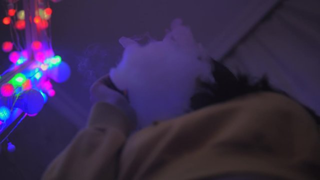 Girl vaping, looking at camera, smoking girl, e-cigarette, night concept