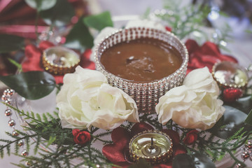 Muslim henna ceremony ritual items and hands close up