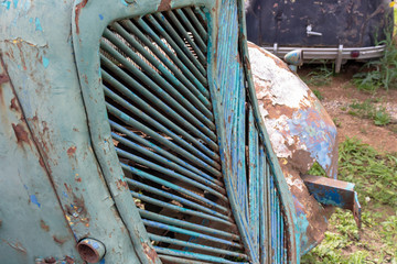 Parts of old abandoned rusty vehicles, crushed cars in scrapyard, junk yard needed to be utilised and reused to protect nature and environment, metal recycling concept