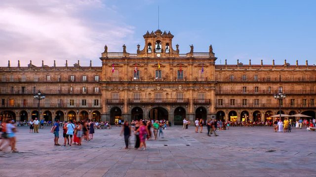 Salamanca, Spain. Crowded Plaza Mayor in Salamanca, Spain during a sunny evening. Time-lapse of motion blurred people in front of the famous landmark