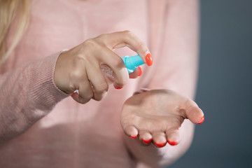 Hand disinfection with antiseptic spray can.