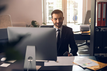 Caucasian businessman looking at somebody in office