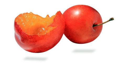 plum fruit with leaves isolated on white background, juicy, sweet fruit dessert, close-up