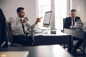 Office clerks are solving their tasks indoors