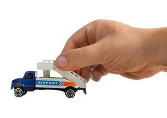 Isolated hand holding airport stair truck.