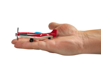 Isolated hand holding race airnplane toy.