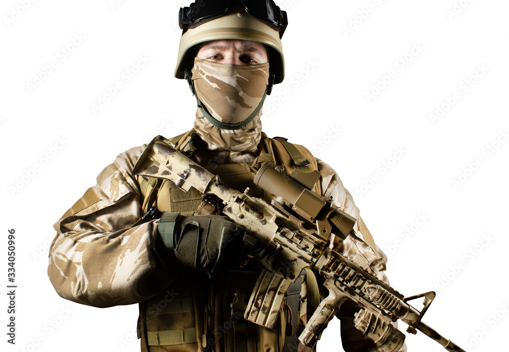 Wall mural Isolated desert soldier with rifle.